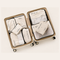 Travestan Packing Cube Set – The Family, 8 pieces, packed in a suitcase